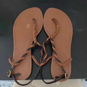 Tan and black sandals